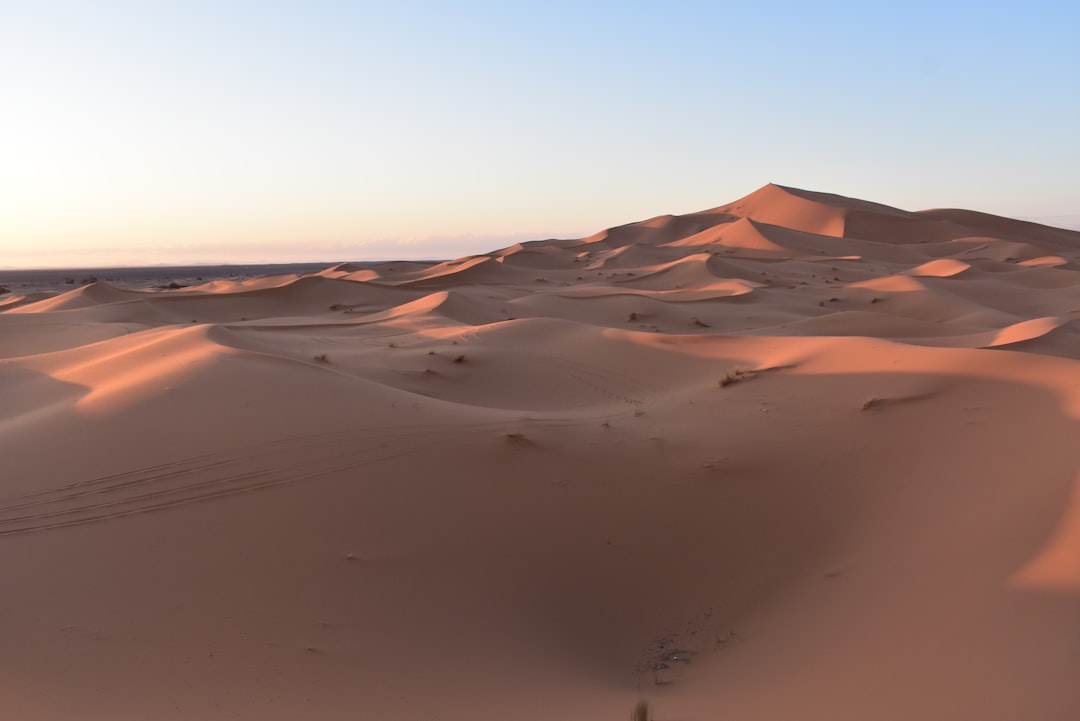 Large golden Merzouga dunes at sunrise in Erg Chebbi